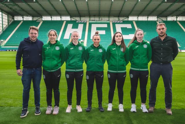 Hibs Women head coach Dean Gibson, left, and Hibs CEO Ben Kensell, right with Ava Kuyken, Kirsty Morrison, Micky McAlonie, Poppy Lawson, and Ailey Tebbett. Picture: Matteo Zara
