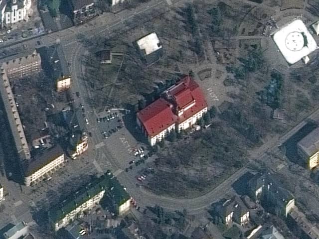 This satellite image provided by Maxar Technologies shows the Mariupol Drama Theater in Mariupol, Ukraine on Monday, March 14, 2022. Ukrainian officials say Russian forces destroyed the theatre in the city of Mariupol where hundreds of people were sheltering.The Maxar satellite imagery firm said images from Monday showed the word children had been written in large white letters in Russian in front of and behind the building. (Maxar Technologies via AP)
