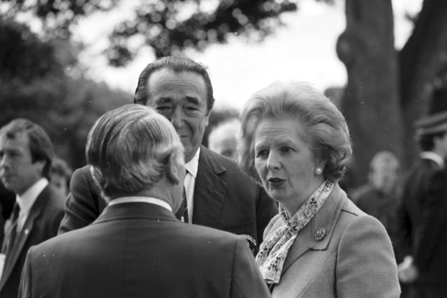 Prime Minister Margaret Thatcher speaks to Peter Heatly and Robert Maxwell when she visited the Games village during the Edinburgh Commonwealth Games.