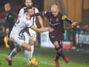 Steven Naismith tries to get around Dunfermline's Lewis Mayo during Friday's defeat. Picture: SNS
