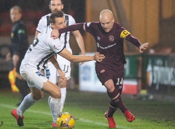 Steven Naismith tries to get around Dunfermline's Lewis Mayo during Friday's defeat. Picture: SNS
