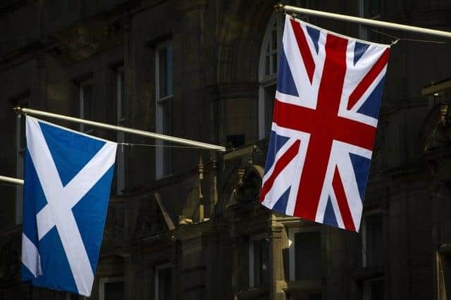 A Scottish Saltire hangs next to a Union Jack