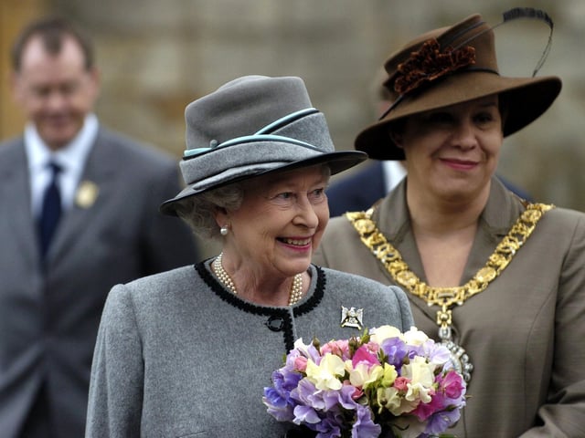 Her Majesty the Queen after receiving the keys of the city of Edinburgh in June 2004. A four-year-old girl from Prestonfield, Edinburgh, presented the Queen with flowers at the ceremony of the keys.