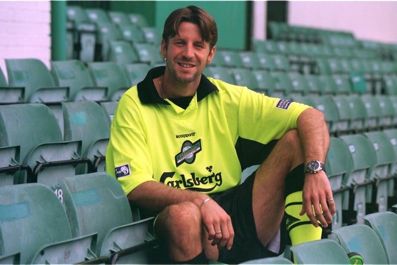 German striker Dirk Lehmann models the new Hibs away strip in 1999. Often referred to by Hibs supporters as the 'Borussia Dortmund' strip or more cheekily at the time as the 'Rock Steady' top, given it's similarity to the outfit worn by stewards in those days at Easter Road.