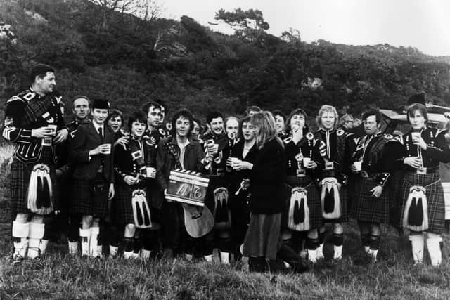 Denny Laine, Paul McCartney and Linda McCartney with the Cambelton pipe band during the filming of the promotional video for the Wings song 'Mull of Kintyre'. Picture: Keystone/Getty Images