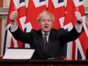 Boris Johnson with four Union Jacks (Picture: Andrew Parsons/No 10 Downing Street)
