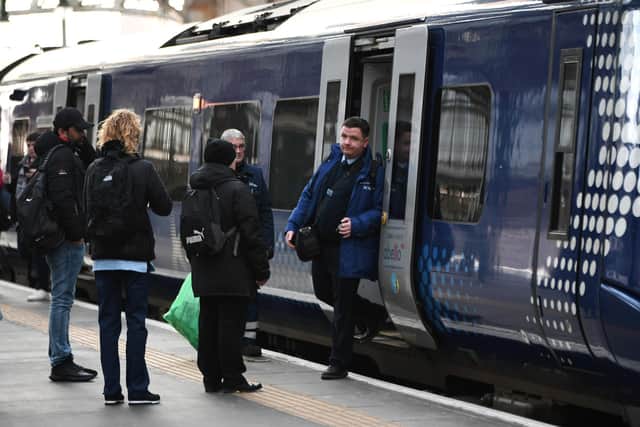 RMT members include conductors and ticket examiners on ScotRail trains. Picture: John Devlin
