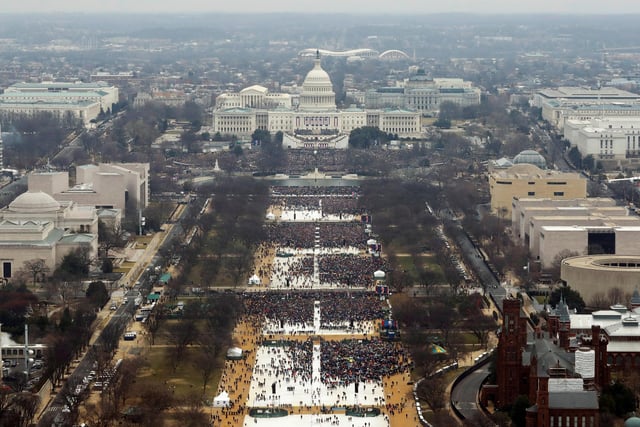 Attendees line the Mall as they watch ceremonies to swear in Donald Trump on Inauguration Day on January 20, 2017 in Washington,
Despite the evidence of your own eyes this clearly shows "“the largest audience ever to witness an inauguration in person and in the world."