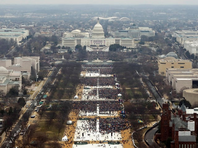 Attendees line the Mall as they watch ceremonies to swear in Donald Trump on Inauguration Day on January 20, 2017 in Washington,
Despite the evidence of your own eyes this clearly shows "“the largest audience ever to witness an inauguration in person and in the world."