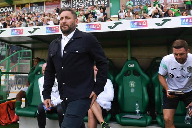 Lee Johnson takes his place in the Hibs dugout ahead of the Premier Sports Cup group match against Clyde