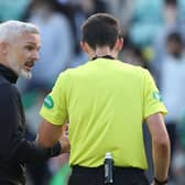 Jim Goodwin has words with referee Kevin Clancy after the game