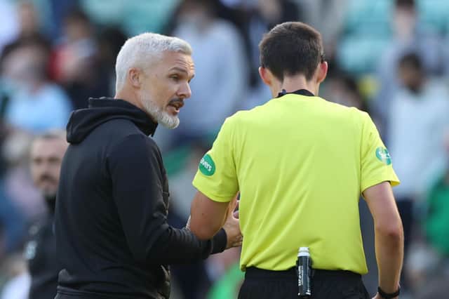 Jim Goodwin has words with referee Kevin Clancy after the game