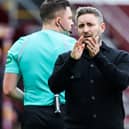 Hibs boss Lee Johnson applauds the travelling support at full-time. Picture: SNS