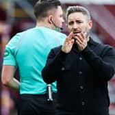 Hibs boss Lee Johnson applauds the travelling support at full-time. Picture: SNS