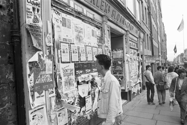 Fly-posting on the windows of High Street shop Alex Sloan in Edinburgh in August 1987.