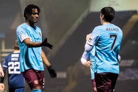 Hearts striker Armand Gnanduillet (left) celebrates with Jamie Walker after scoring his second goal to make it 4-0 against Raith Rovers at Stark's Park. (Photo by Ross Parker / SNS Group)