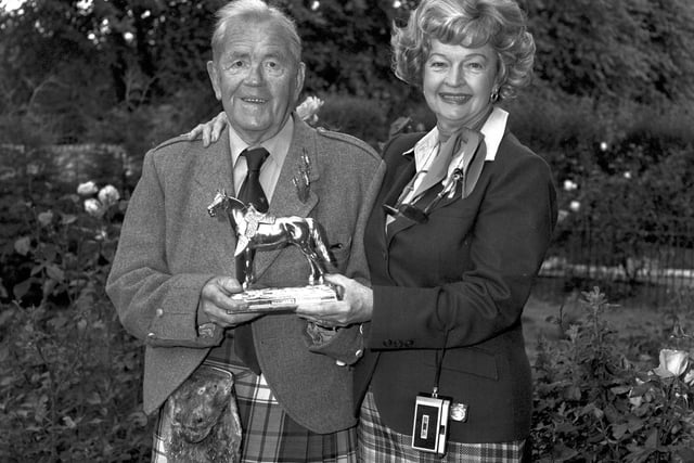 Dale Evans, wife of film star Roy Rogers, receives a stauette of her husband's horse Trigger from William Merrilees in Edinburgh in August 1981.