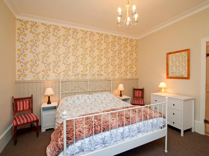 The garden cottage bedroom, complete with comfy kingsize bed.