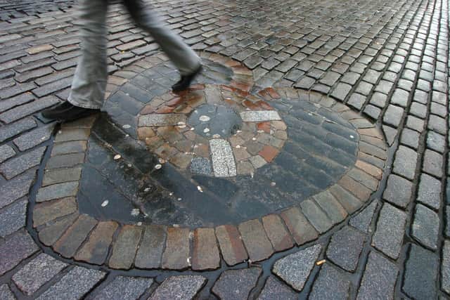 The Heart of Midlothian on the Royal Mile, where it said u should spit upon it if you walk over it to bring luck.
