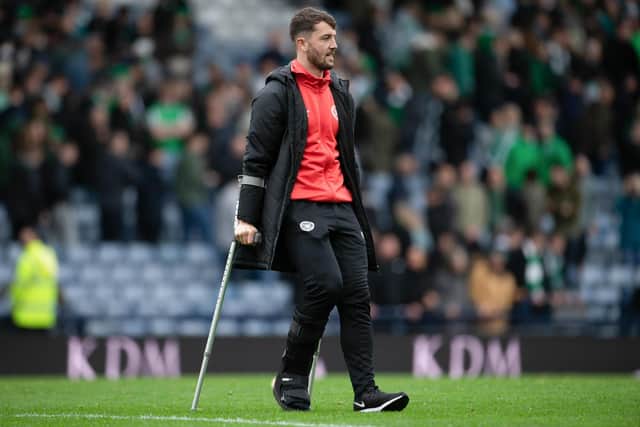 Hearts defender Craig Halkett on crutches at full-time on Saturday at Hampden.