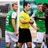 Hibs defenders Ryan Porteous and Paul Hanlon look on as Rangers striker Alfredo Morelos argues with referee Don Robertson. (Photo by Craig Williamson / SNS Group)