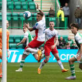 Paul Hanlon scores for Hibs with a header in injury time. Picture: SNS