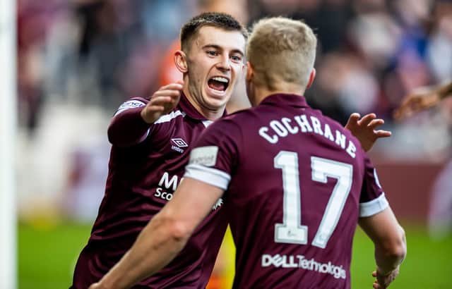Ben Woodburn scored twice and Alex Cochrane once as Hearts beat Dundee Utd 5-2.