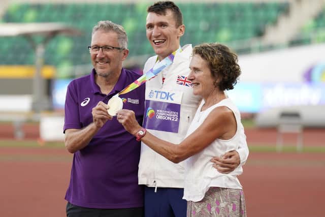 Geoff and Susan Wightman celebrate with their son Jake after he wins gold in the men's 1500m at the World Athletics Championships in Oregon. Picture: Landis/AP/Shutterstock