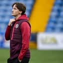 Hearts midfielder Alex Lowry must watch the Viaplay Cup semi-final against Rangers from the sidelines. Pic: SNS