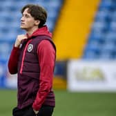 Hearts midfielder Alex Lowry must watch the Viaplay Cup semi-final against Rangers from the sidelines. Pic: SNS