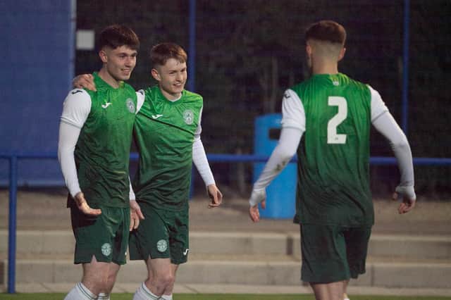 Connor Young, left, celebrates his goal with Murray Aiken and Jacob MacIntyre. Picture: Maurice Dougan