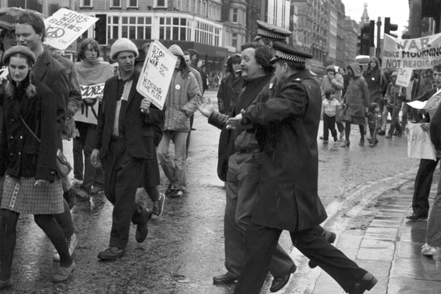 Members of the Edinburgh Stop The War Committee and CND protest about sending the British fleet to the Falklands in May 1982. Police step in.