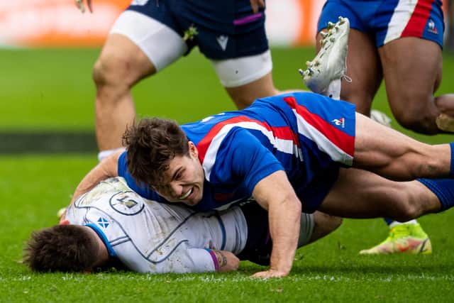 France captain Antoine Dupont flattens Scotland scrum-half Ali Price during the visitors' 36-17 win at BT Murrayfield. (Photo by Ross MacDonald / SNS Group)