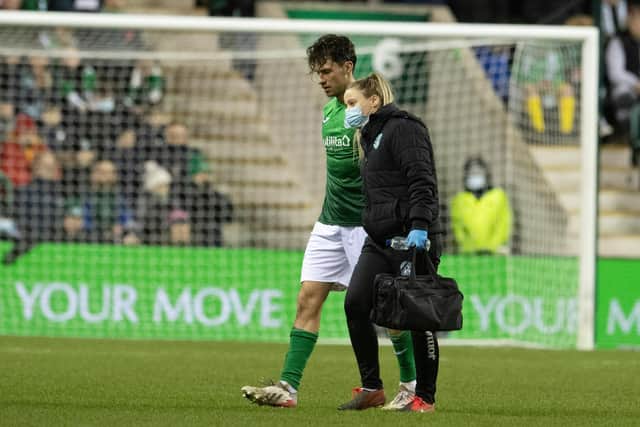 Joe Newell is helped off the park after sustaining an injury in the Edinburgh derby in the 69th minute