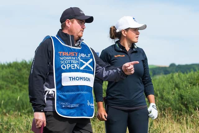 Michele Thomson and her new caddie, Hadley Trenfield, talk through a shot in the opening round of the Trust Golf Women's Scottish Open at Dumbarnie Links. Picture: Tristan Jones