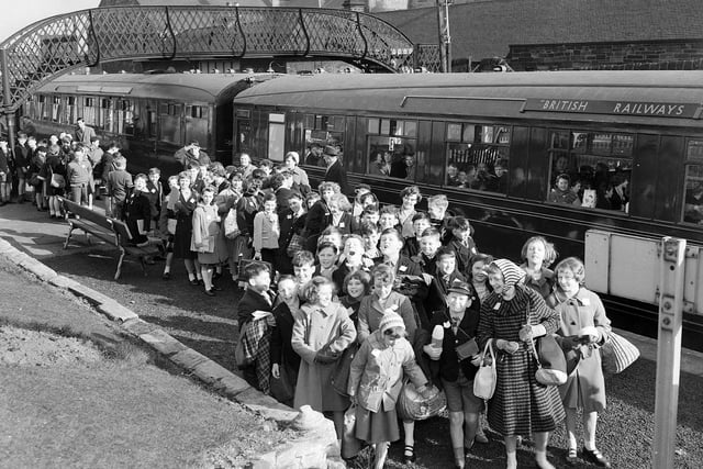 Murrayburn School pupils board British Rail TV Train bound for St Andrews at Gorgie East Station in March 1961. The train, equipped with closed-circuit television, allowed the children to be taught as they travelled along.