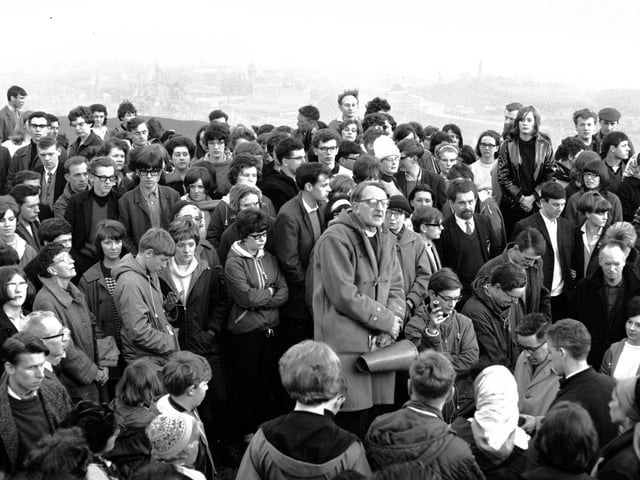 The Reverend Dr. Ronald Selby Wright, who was minister at Canongate Kirk from 1937 until 1977, conducts a May Day service on top of Arthur's Seat.