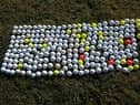 The haul of discarded golf balls found at Gladhouse Reservoir.
