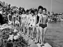 Contestants in the 1964 Miss Dunbar beauty pageant pose beside Dunbar Lido.