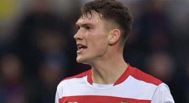Former Doncaster defender Joe Wright has an offer from Hearts.