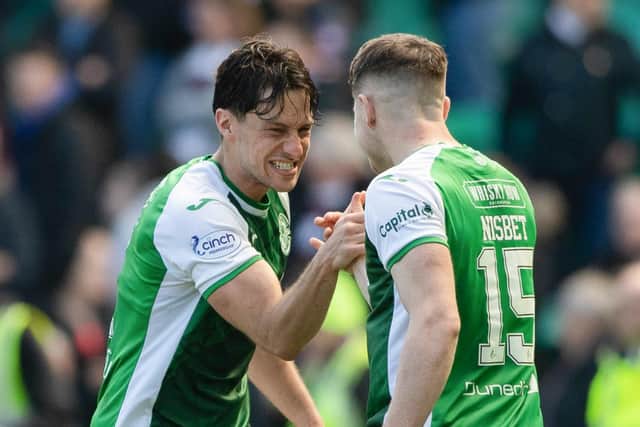 Joe Newell, left, and Kevin Nisbet celebrate at full time after beating Hearts 1-0 at Easter Road