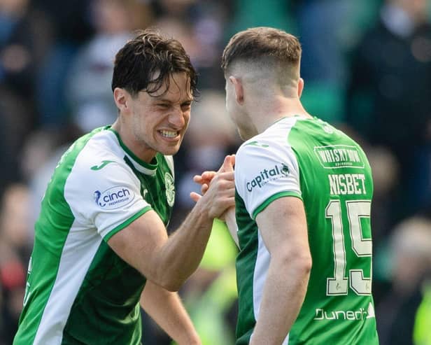 Joe Newell, left, and Kevin Nisbet celebrate at full time after beating Hearts 1-0 at Easter Road
