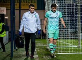 Hibs' Kevin Nisbet went off with a hamstring injury during the 1-1 draw at Ross County.