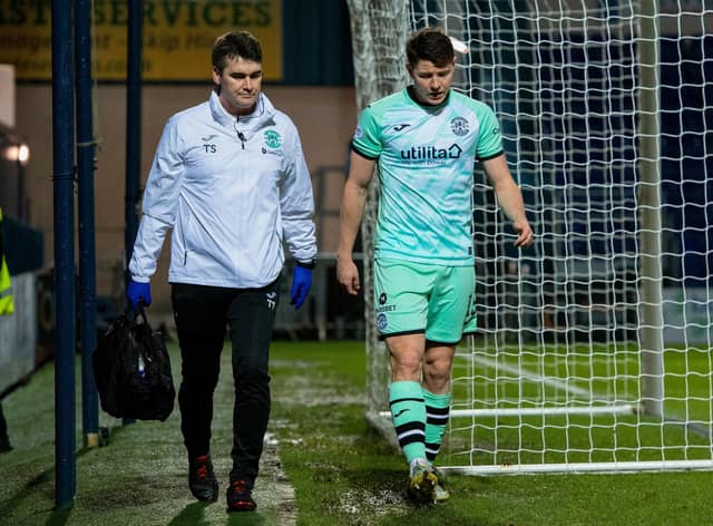 Hibs' Kevin Nisbet went off with a hamstring injury during the 1-1 draw at Ross County.