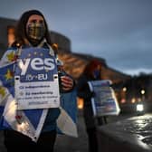 Pro-EU demonstrators gather outside the Scottish Parliament for a protest against Brexit on December 31, 2020, the day the UK formally left the European Union (Picture: Jeff J Mitchell/Getty Images)