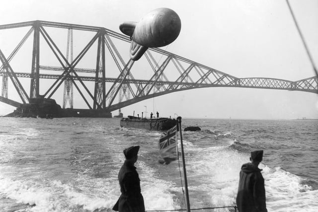 One of the barrage balloons protecting the Forth Bridge from German aircraft is towed into the Firth of Forth in December 1939.