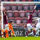 Regan Tumilty scores what proved to be the crucial third goal for Raith in their win over Hearts. Picture: SNS