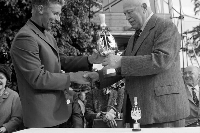 Lord Roseberry presents the Pringle of Scotland Trophy to Cobie Legrange at Barnton in June 1965.
