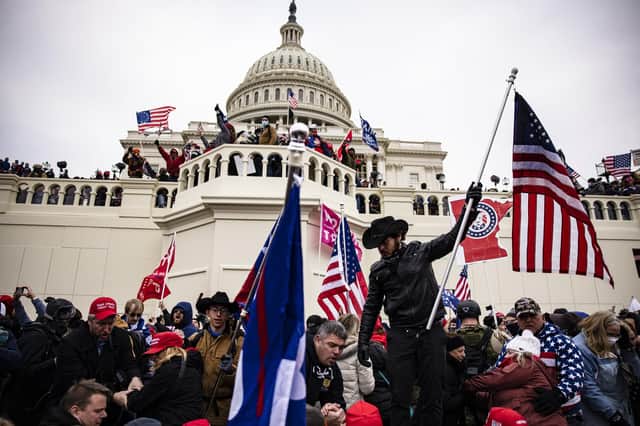Pro-Trump supporters storm the U.S. Capitol following a rally with President Donald Trump on January 6, 2021 in Washington, DC. (Photo by Samuel Corum/Getty Images)