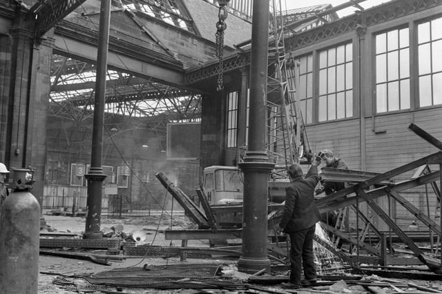 Workmen use cutting equipment during the demolition of part of  Caledonian railway station (Caley Station) in Edinburgh, March 1970